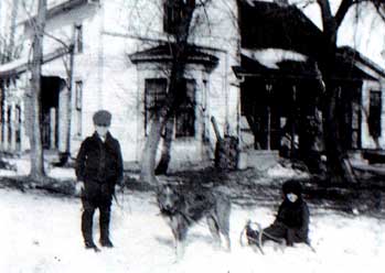 [Photo: Ralph, Dorothy and their dog
'Collie' in front of their house. Circa 1914.]