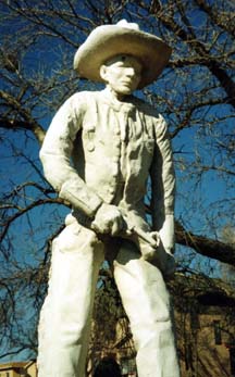 [photo: Cowboy Statue on Boot Hill, Dodge City, by Dr.
Oscar Simpson, DDS, 1929. C. 1998, G.L.]