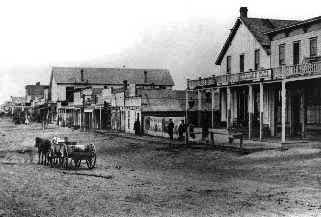 [Photo: Front Street, Dodge City, 1879, looking west from
Atchison, Topeka and Santa Fe train depot.  All rights reserved, FCHS.]