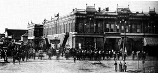 [Photo: The 1885 brick Front Street buildings, destroyed
in 1970. Robert Wright's store is seen at end of block. All rights reserved, FCHS.]