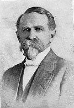 [A photographic portrait of 'Dr. T.L.McCarty. One of the Several Old Timers of Dodge City.' McCarty was the first doctor in Dodge City. The picture is somewhat faded, but shows a distinguished face, with a high forehead, keen eyes and a full adornment of facial hair, a mature specimen of the popular moustache and goatee style. His coat and vest appear to be made of fine stuff, and he stands out among other such portraits for his spotless white shirt and bow tie. He has an elegant air about him, but there is a massiveness and set to his jaw that suggests that he may have been a man of considerable physical strength]