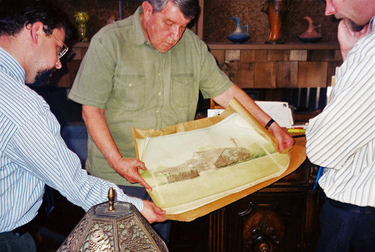 Jay Price, Glen Mitchell, and Kent Salisbury look over original drawings by Bruce Goff of Mitchell house, May 11, 2007.