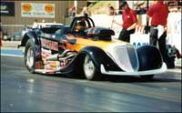 [photograph:  prepares for a run during a NHRA event in July 2003 at Denver. Dodge City native Burkhart was ninth in the nation and 10th in the region in the super gas division.]