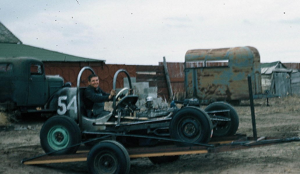 [photograph: David Davey Ross, Flying Farmer, in No. 54 at McCarty Speedway, Dodge City, 1961 Second car Ross built -- he was 17 years old. Car was pink -- now owned and restored by Troy Burnett, Dodge City, KS.]