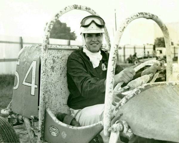 [photograph: David Davey Ross, Flying Farmer, in No. 54 at McCarty Speedway, Dodge City, 1961 Second car Ross built -- he was 17 years old. Car was pink -- now owned and restored by Troy Burnett, Dodge City, KS.]