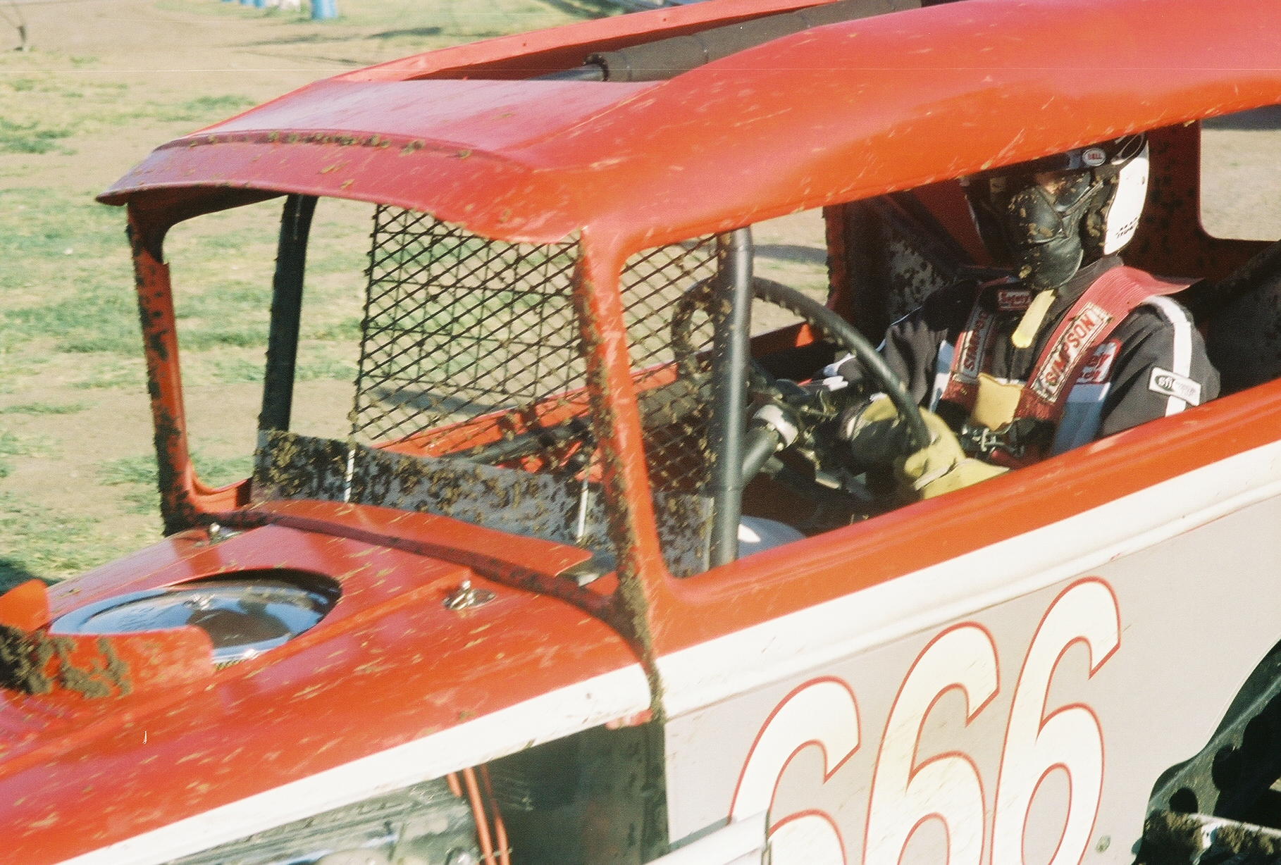 [photograph: Troy Burnett in his No. 666, Jetmore Motorplex, Evert Issac Memorial Vintage Car Race, July 30, 2005, Jetmore, KS. Original owner, Bob Anton; driver, Dennis Anton; Anton's 66, Kinsley, KS.]